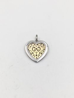 Colgante Finor de plata y oro con forma de corazón.