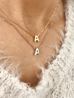 Initialen aus 18 Karat Weißgold mit Brillanten