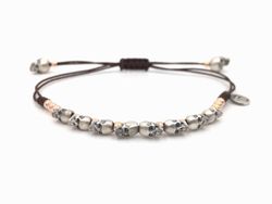 Pulsera de plata con mini-calaveras en plata y plata chapada en oro rosa