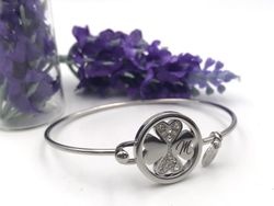Pulsera rígida de lotus en acero con Trébol